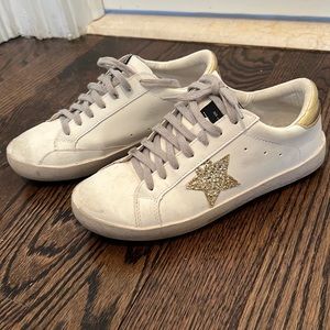 White and gold sneakers